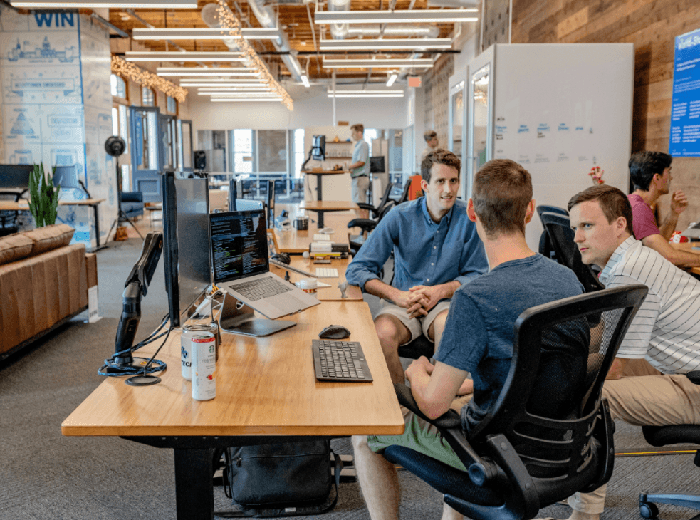Startup SEO agency team analyzing data and strategy in a modern office