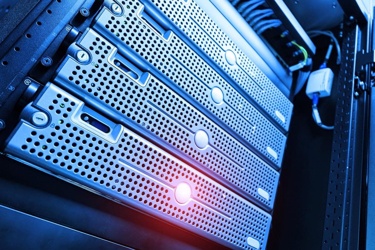 Row of server racks representing the compute power behind AI scaling