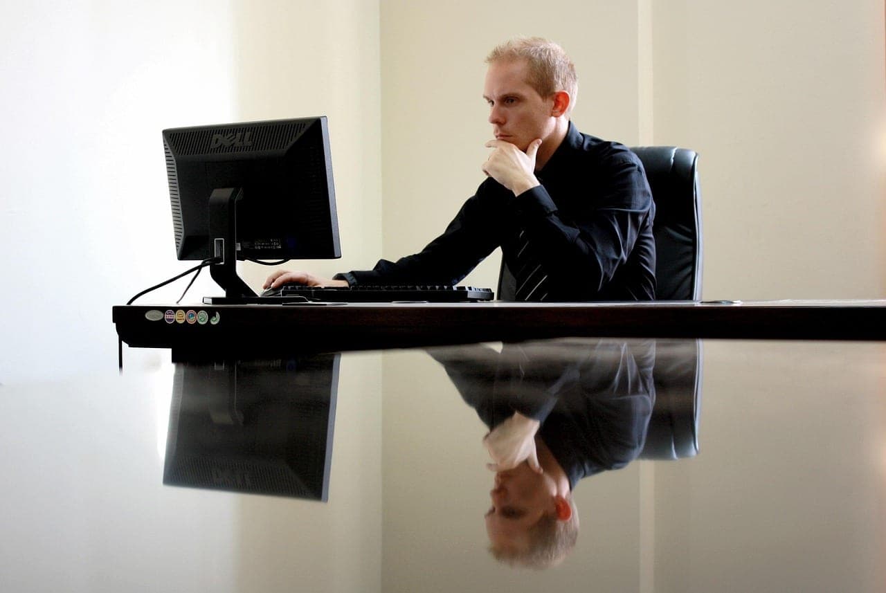 Marketing analyst reviewing search performance metrics on a computer monitor